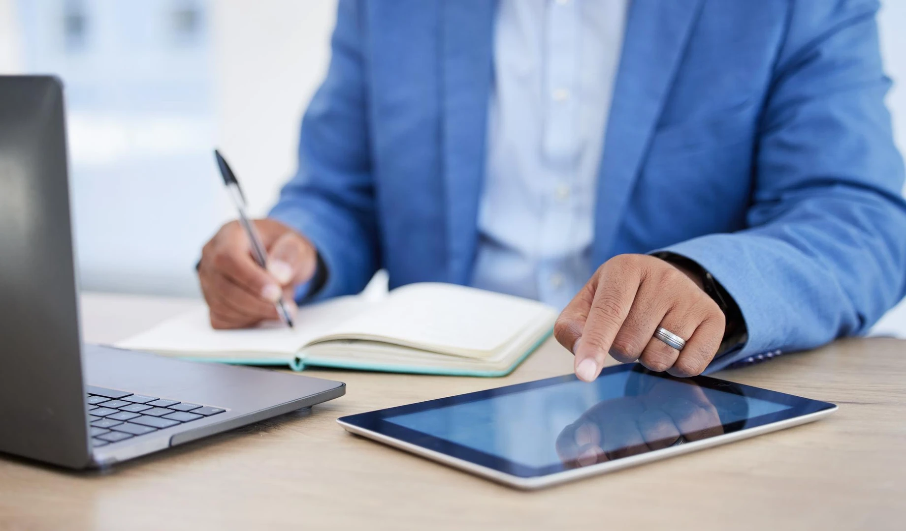 Tablet notebook and writing with businessman and laptop for research planning and strategy Schedule agenda and management wit