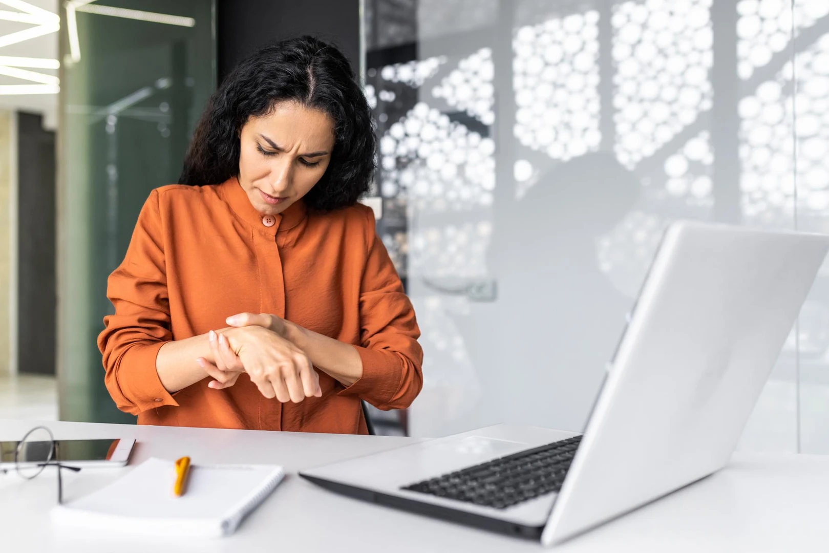 Young muslim business woman freelancer student works and studies online using a laptop in the office