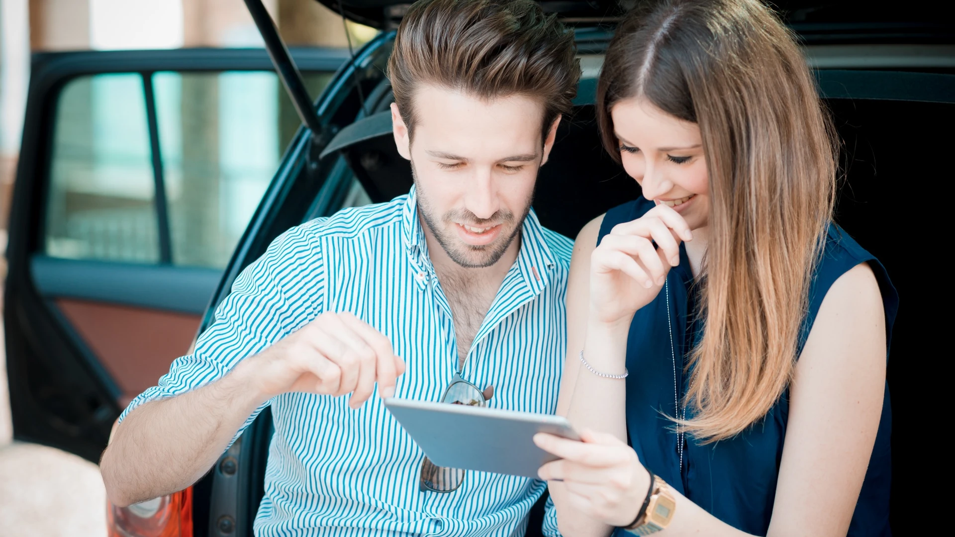 young beautiful couple lovers using tablet