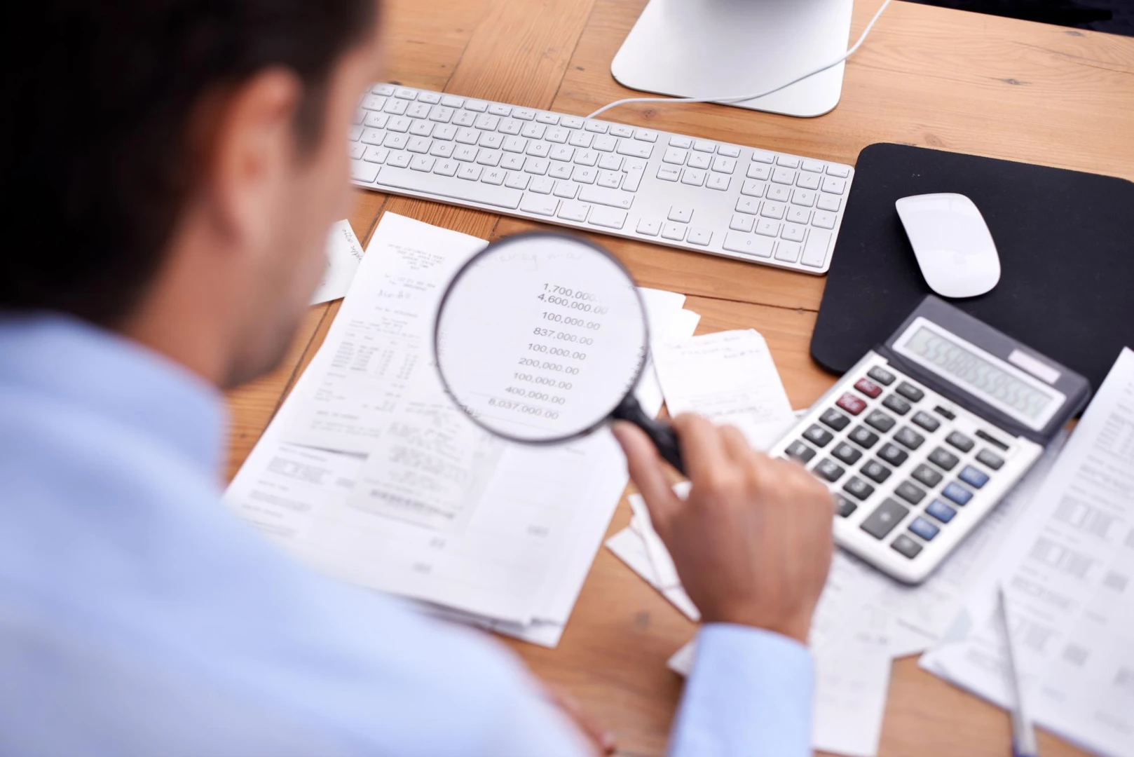 Finance businessman and magnifying glass in office with bookkeeper career budget and bills planning Entrepreneur person and a