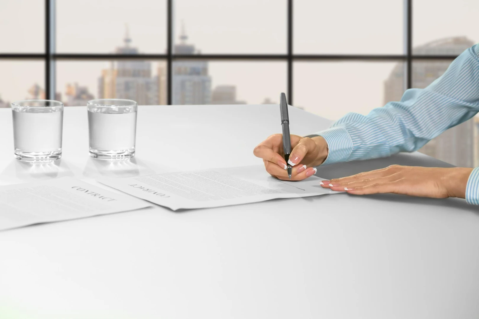 Female office employee signing papers. Female clerk signing office papers. Woman&amp;#39;s daytime paperwork. Job in big city
