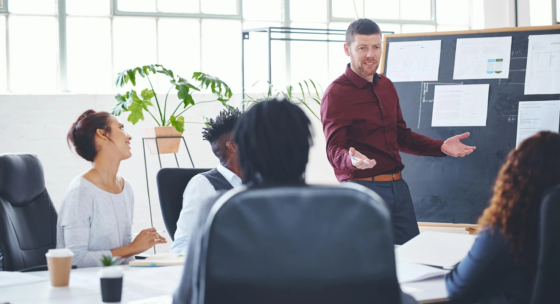 Man presentation and talking with staff in office for creative startup planning and new venture Speaker team and briefing wit