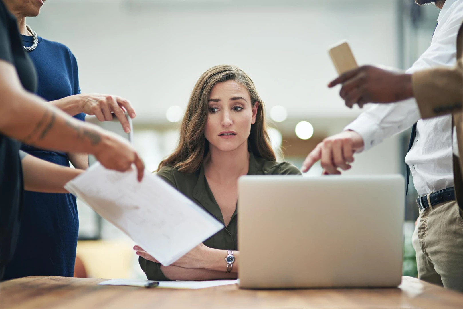 Shes got a serious case of the Monday blues Cropped shot of a young businesswoman feeling overwhelmed by her colleagues in th