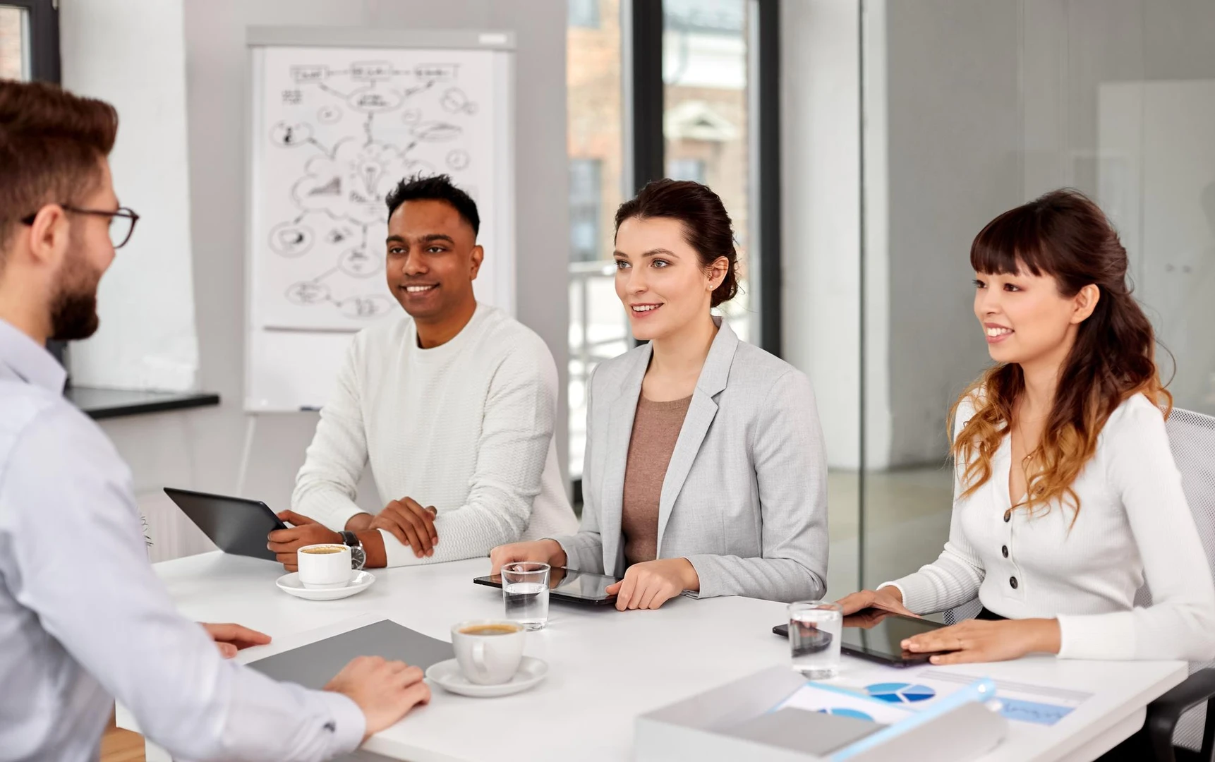 recruiters having job interview with male employee