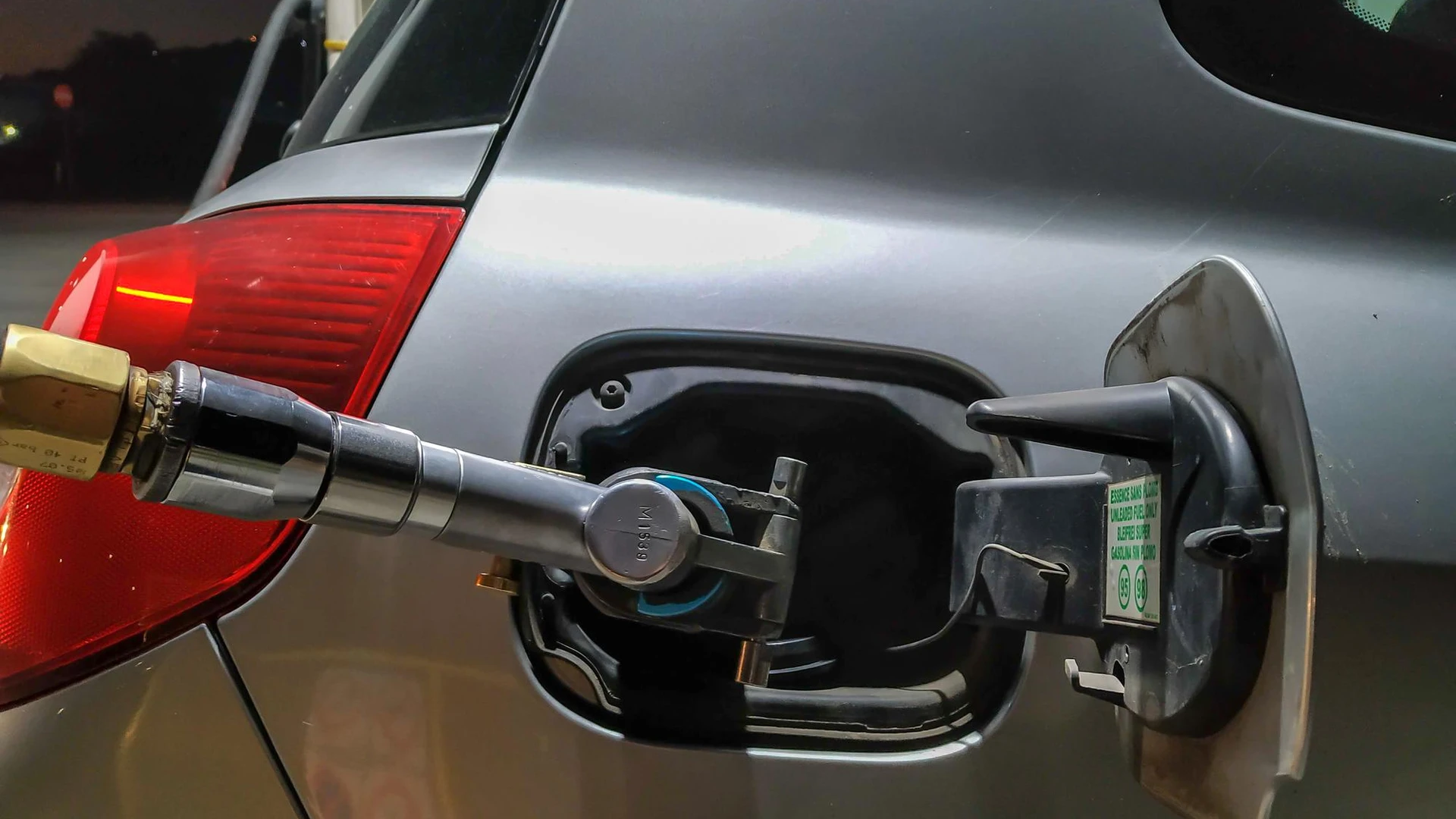 Close-up of car getting refueled